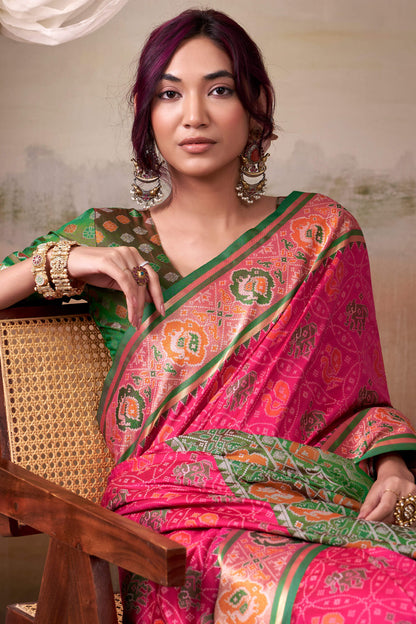 Amiable Pink Patola Silk Saree With Flamboyant Blouse Piece
