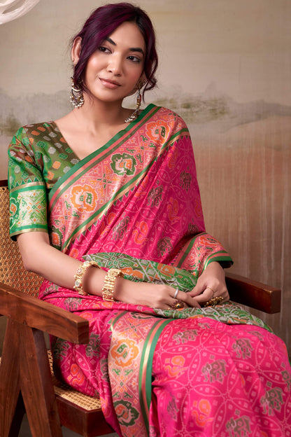 Amiable Pink Patola Silk Saree With Flamboyant Blouse Piece