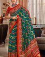 Pleasurable Rama Patola Silk Saree with Felicitous Blouse Piece