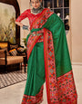 Denouement Dark Green Patola Silk Saree with Moiety Blouse Piece