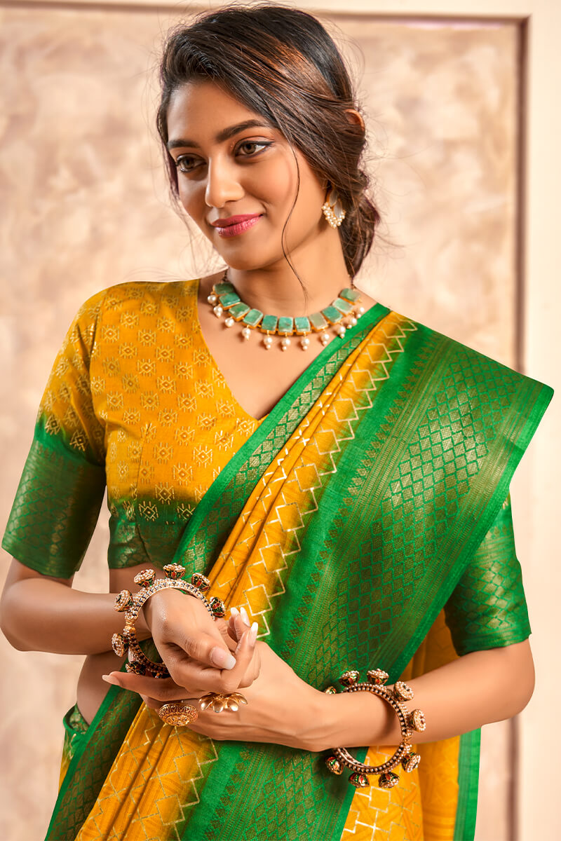 Ephemeral Yellow Foil Printed Dola Silk Saree With Inimitable Blouse Piece