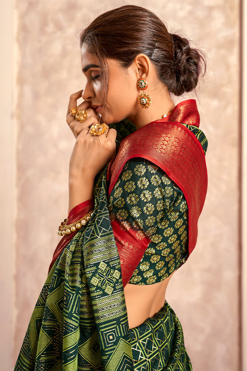 Load image into Gallery viewer, Enigmatic Dark Green Foil Printed Dola Silk Saree With Incomparable Blouse Piece
