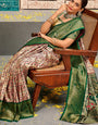 Eclat Beige and Green Kanjivaram Silk Saree With Jubilant Blouse Piece