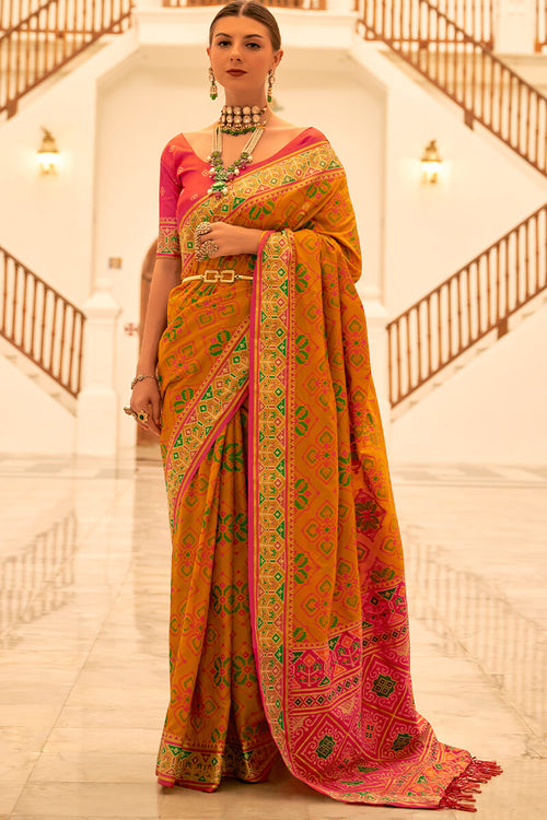 Load image into Gallery viewer, Dissemble Mustard Patola Silk Saree with Angelic Blouse Piece
