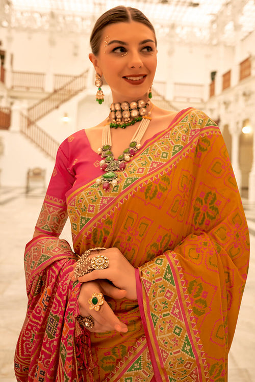 Load image into Gallery viewer, Dissemble Mustard Patola Silk Saree with Angelic Blouse Piece
