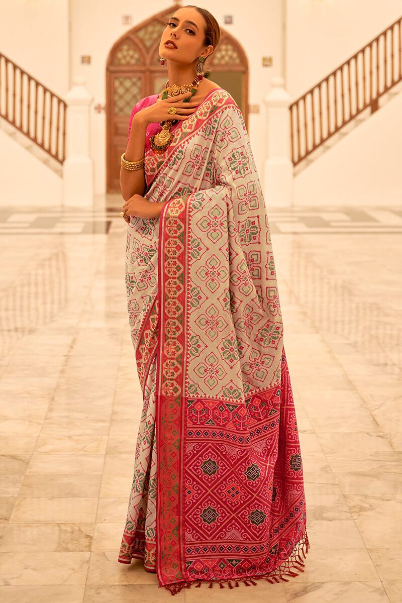 Flameboyant Beige Patola Silk Saree with Captivating Blouse Piece