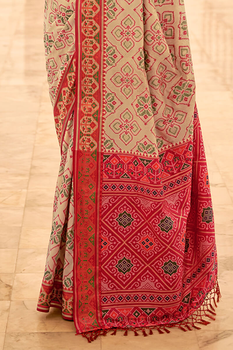 Flameboyant Beige Patola Silk Saree with Captivating Blouse Piece