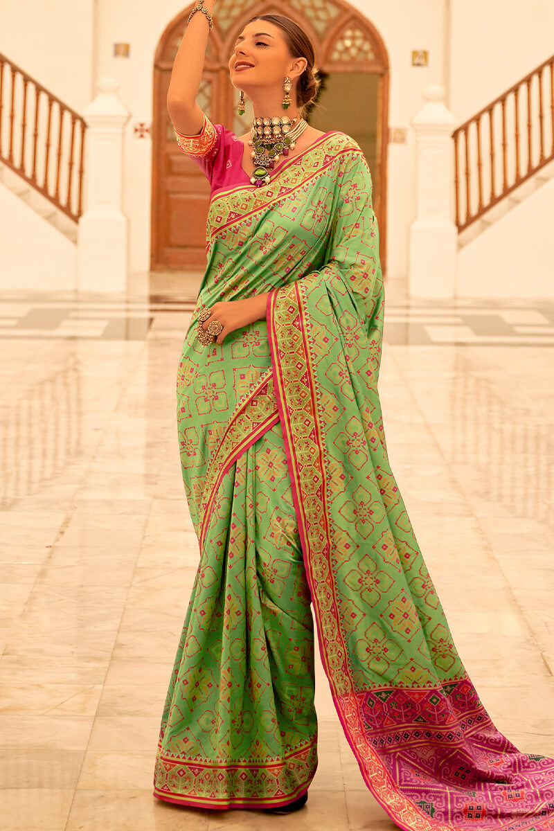 Deserving Pista Patola Silk Saree with Surpassing Blouse Piece