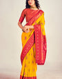 Symmetrical Yellow Soft Banarasi Silk Saree With Snappy Blouse Piece