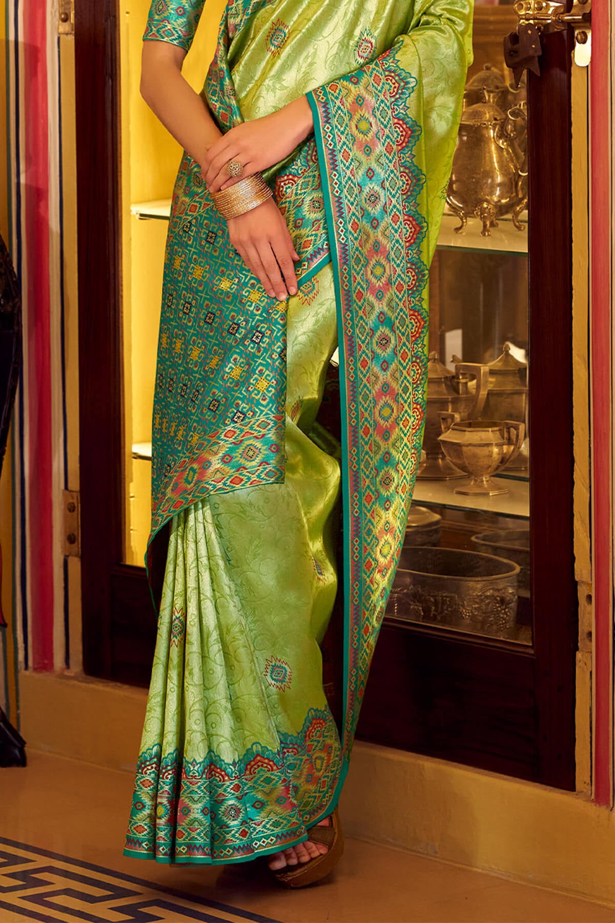 Elision Green Tissue Patola Silk Saree with Effulgent Blouse Piece