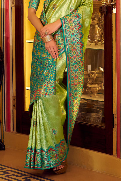 Elision Green Tissue Patola Silk Saree with Effulgent Blouse Piece