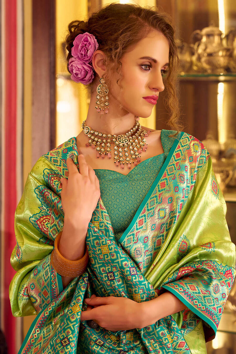 Elision Green Tissue Patola Silk Saree with Effulgent Blouse Piece