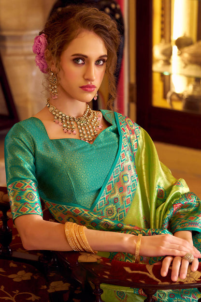Elision Green Tissue Patola Silk Saree with Effulgent Blouse Piece