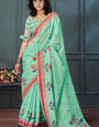 Cynosure Sea Green Cotton Silk Saree With Eloquence Blouse Piece