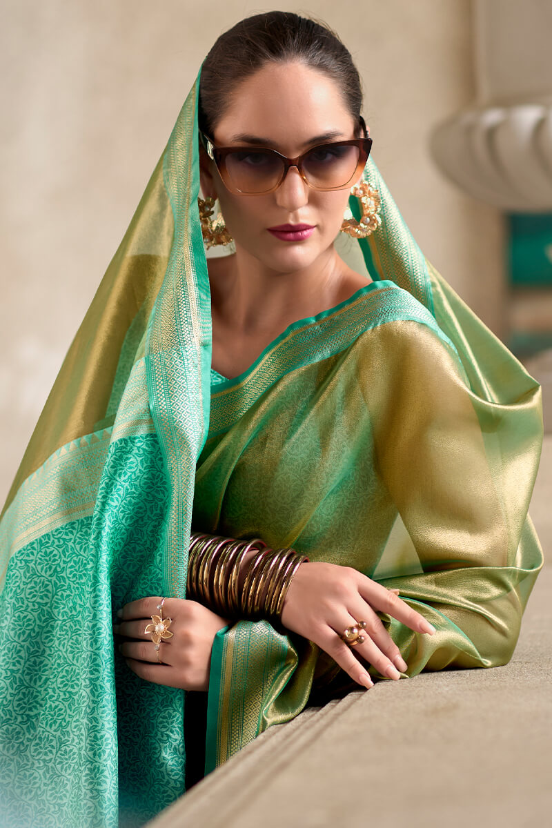 Sumptuous Green Soft Tissue Silk Saree With Gossamer Blouse Piece