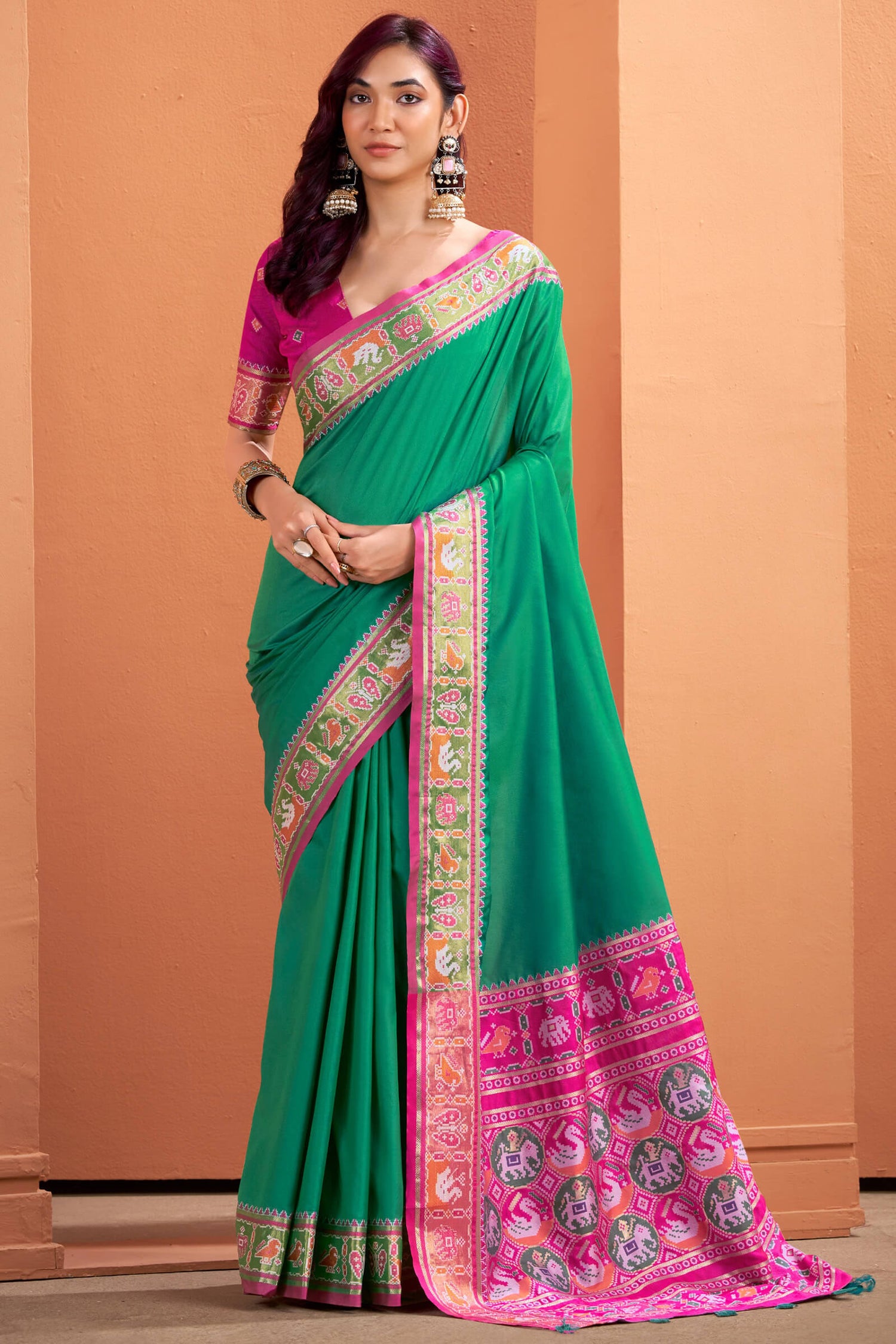 Flamboyant Green Patola Silk Saree with Resplendent Blouse Piece