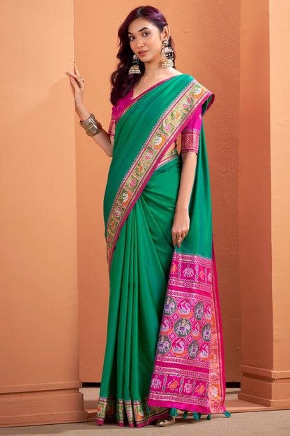 Flamboyant Green Patola Silk Saree with Resplendent Blouse Piece