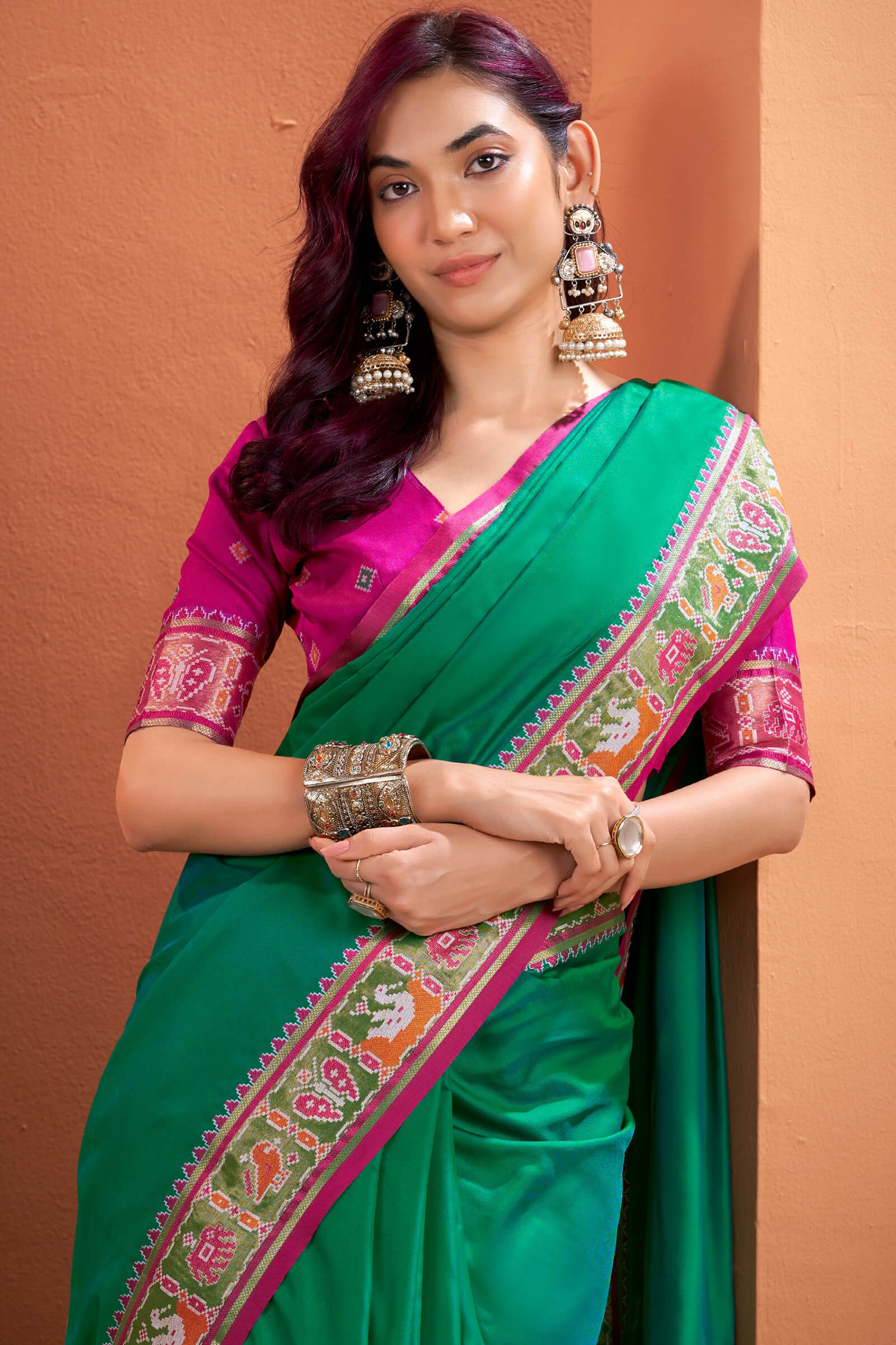 Flamboyant Green Patola Silk Saree with Resplendent Blouse Piece