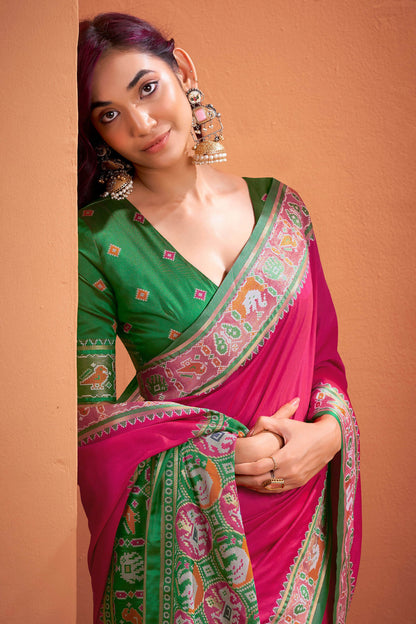 Murmurous Dark Pink Patola Silk Saree with Woebegone Blouse Piece