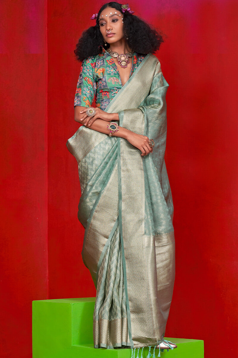 Nemesis Sea Green Soft Banarasi Tissue Silk Saree With Divine Blouse Piece