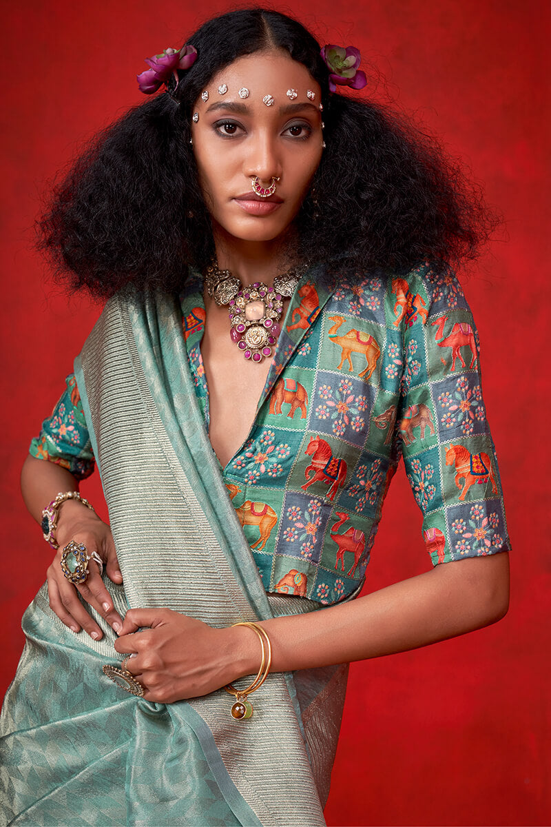 Nemesis Sea Green Soft Banarasi Tissue Silk Saree With Divine Blouse Piece