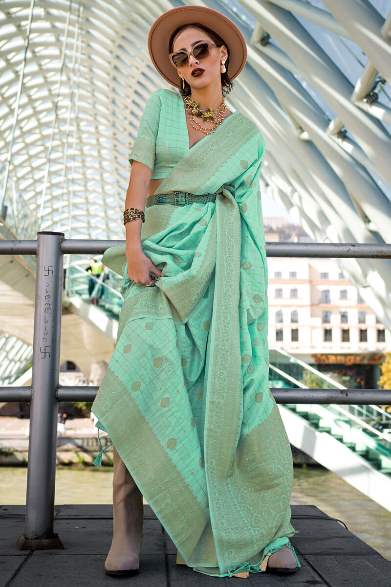 Adoring Sea Green Soft Banarasi Silk Saree With Brood Blouse Piece