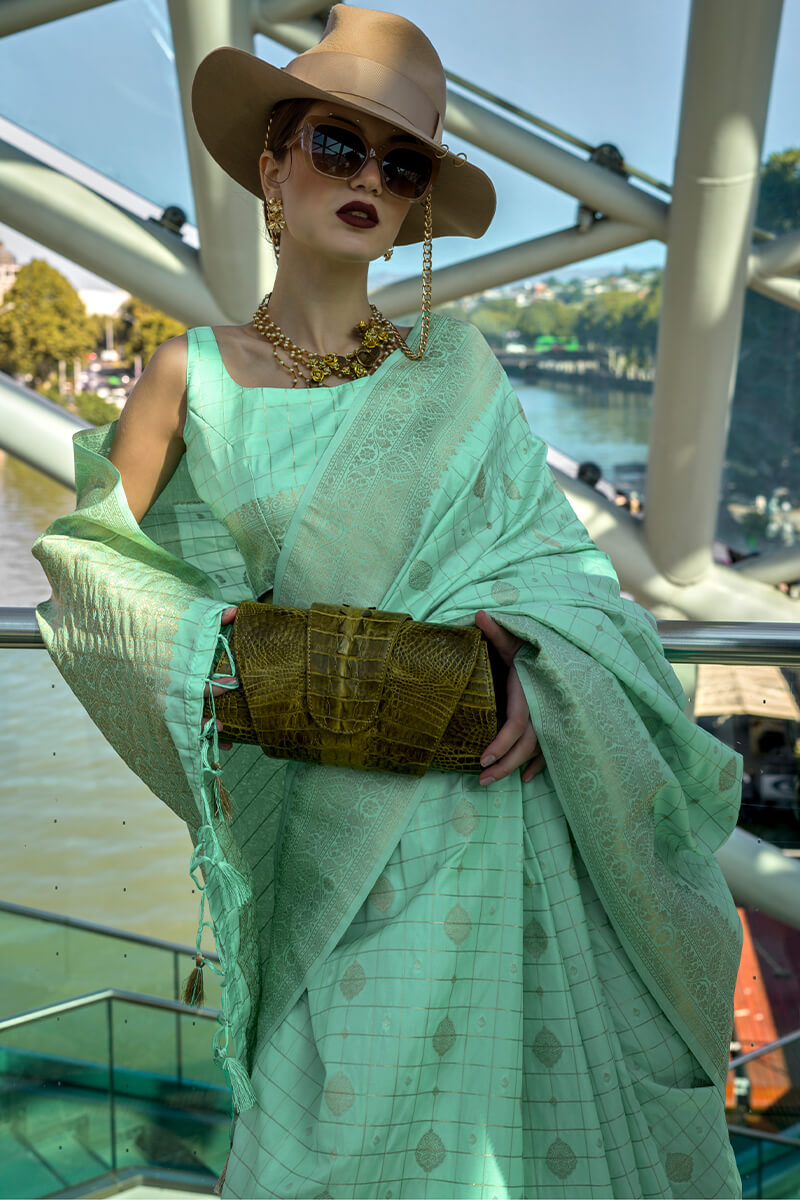 Adoring Sea Green Soft Banarasi Silk Saree With Brood Blouse Piece