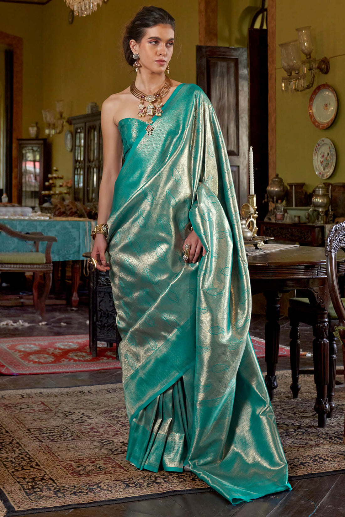 Stunner Turquoise Kanjivaram Silk Saree With Luminous Blouse Piece