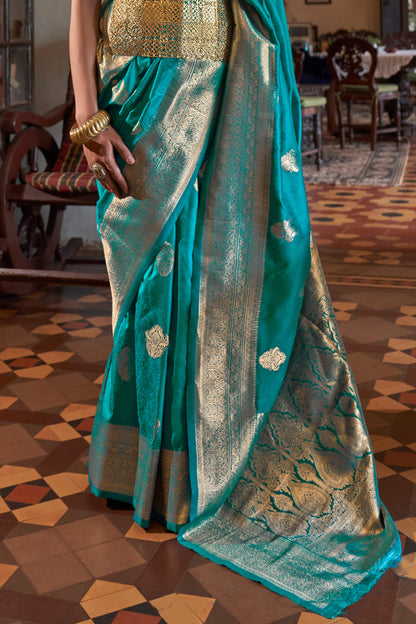 Sonorous Firozi Soft Banarasi Silk Saree With Charismatic Blouse Piece
