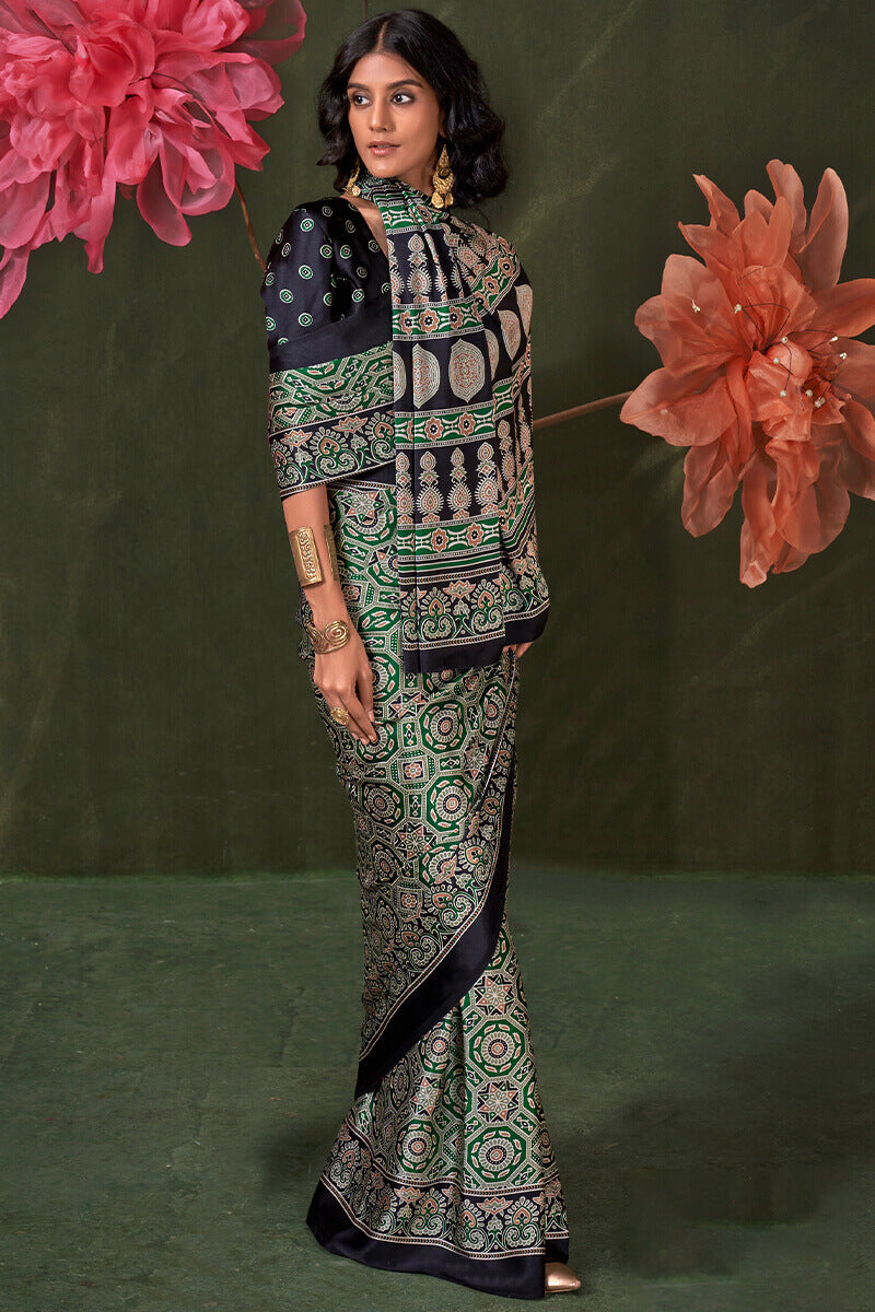 Glamorous Green Ajrakh Printed Satin Silk Saree With Cynosure Blouse Piece