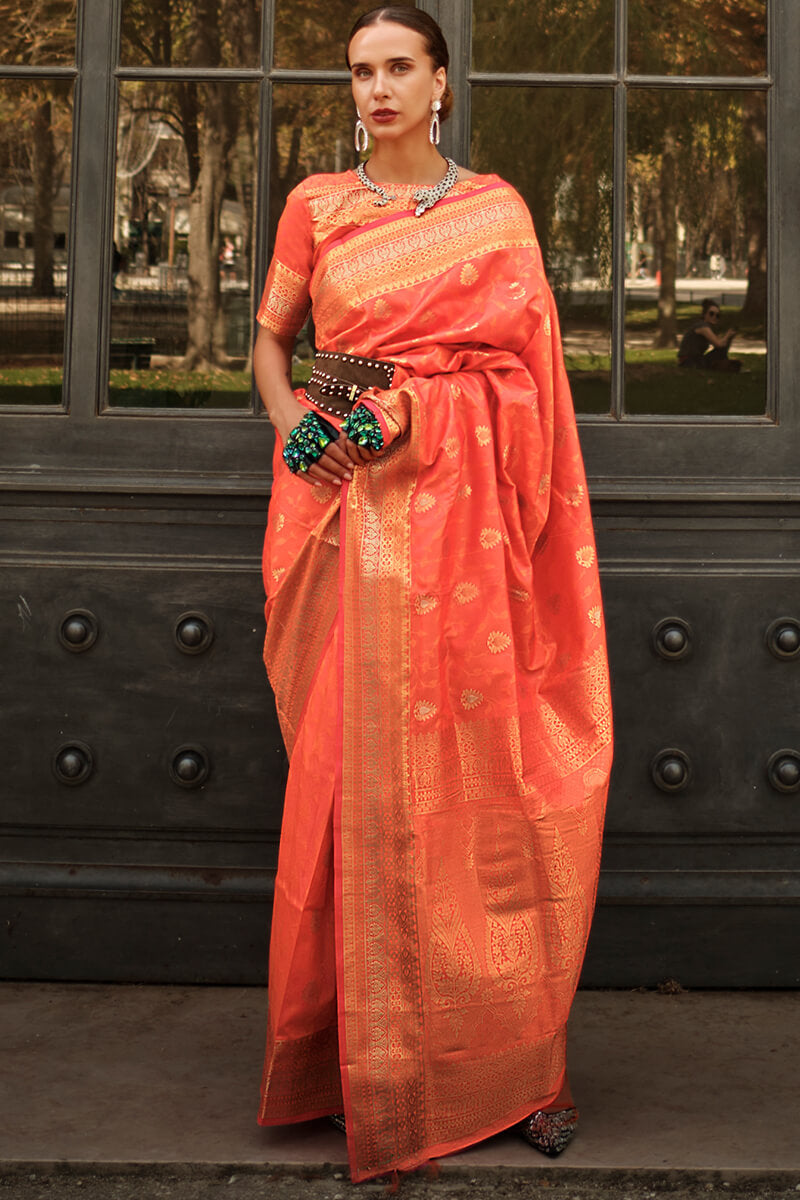 Appealing Orange Soft Banarasi Silk Saree With Groovy Blouse Piece