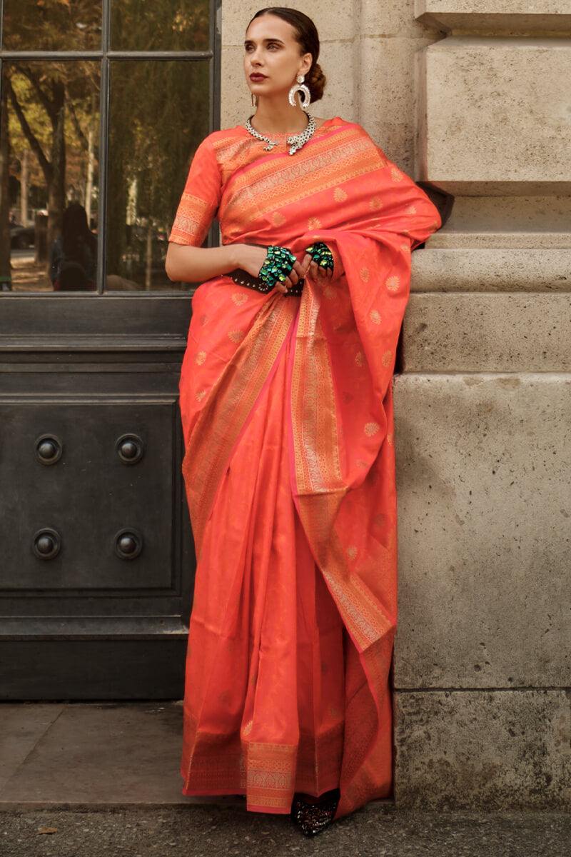 Appealing Orange Soft Banarasi Silk Saree With Groovy Blouse Piece