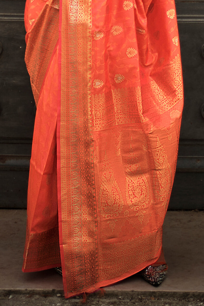 Appealing Orange Soft Banarasi Silk Saree With Groovy Blouse Piece