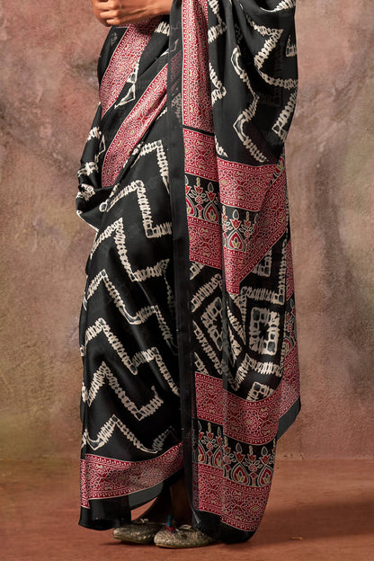 Comely Black Ajrakh Printed Satin Silk Saree With Demanding Blouse Piece