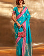 Glowing Firozi Soft Banarasi Silk Saree With Eye-catching Blouse