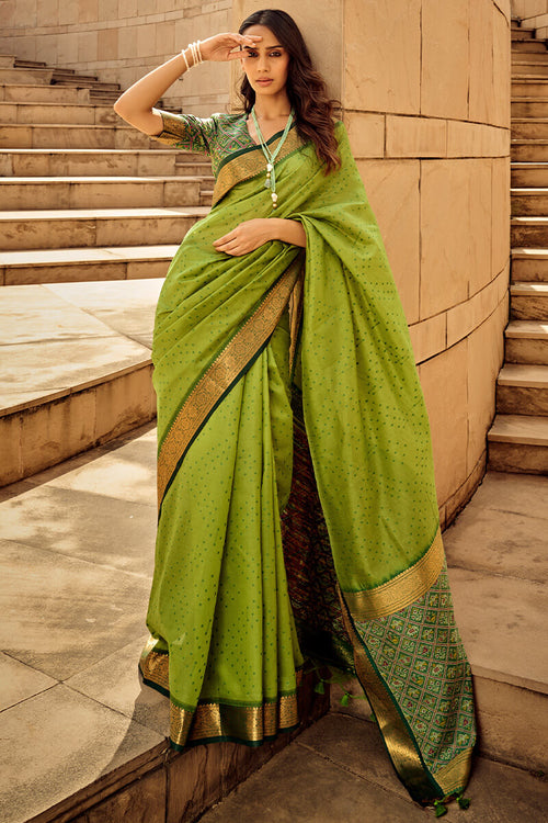 Load image into Gallery viewer, Ornate Green Patola Silk Saree with Tremendous Blouse Piece
