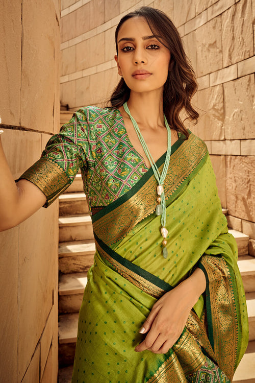 Load image into Gallery viewer, Ornate Green Patola Silk Saree with Tremendous Blouse Piece
