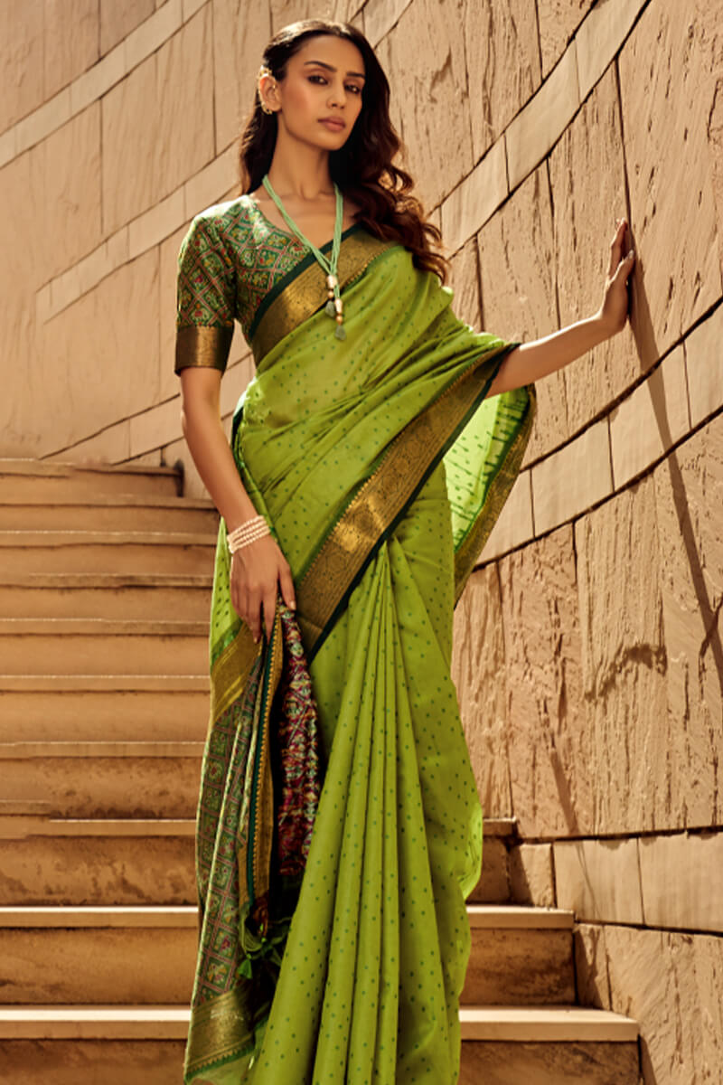 Ornate Green Patola Silk Saree with Tremendous Blouse Piece