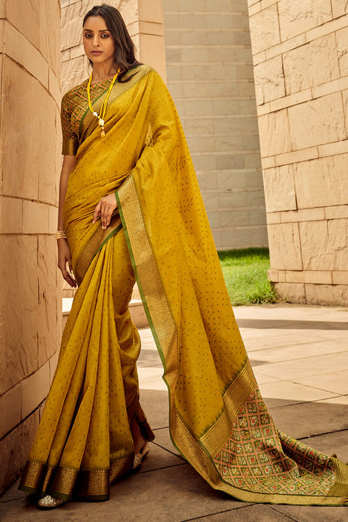 Load image into Gallery viewer, Twirling Mustard Patola Silk Saree with Glorious Blouse Piece
