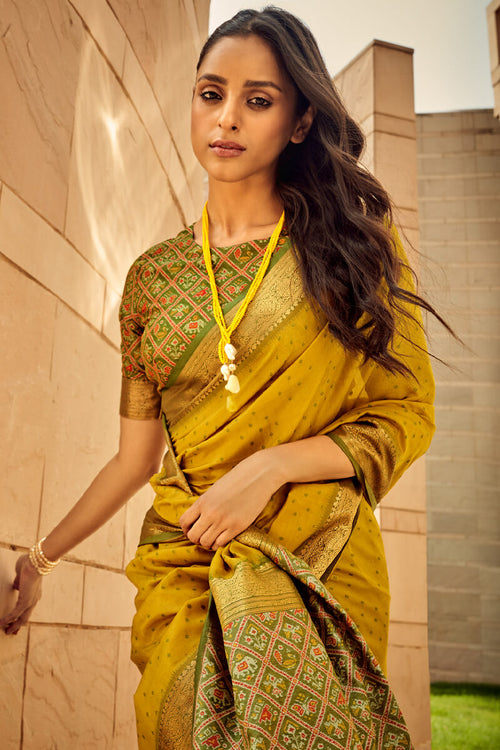 Load image into Gallery viewer, Twirling Mustard Patola Silk Saree with Glorious Blouse Piece
