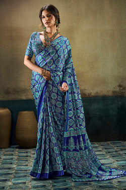 Cynosure Blue Ajrakh Printed Satin Silk Saree With Embrocation Blouse Piece