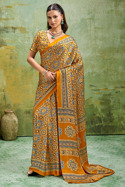 Elegant Mustard Ajrakh Printed Satin Silk Saree With Winsome Blouse Piece