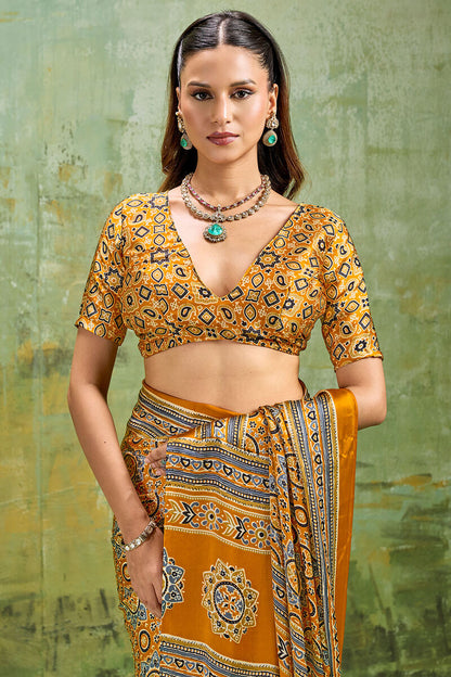 Elegant Mustard Ajrakh Printed Satin Silk Saree With Winsome Blouse Piece