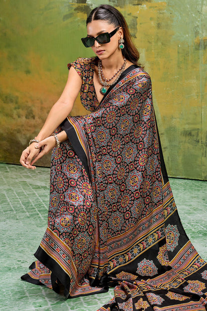 Sizzling Black Ajrakh Printed Satin Silk Saree With Prominent Blouse Piece