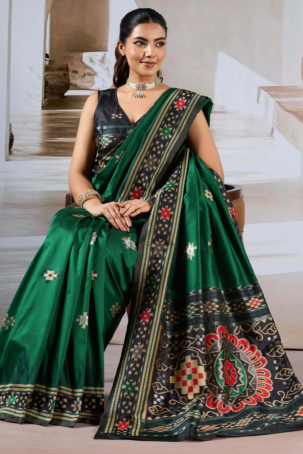 Seraphic Dark Green Patola Silk Saree with Extraordinary Blouse Piece