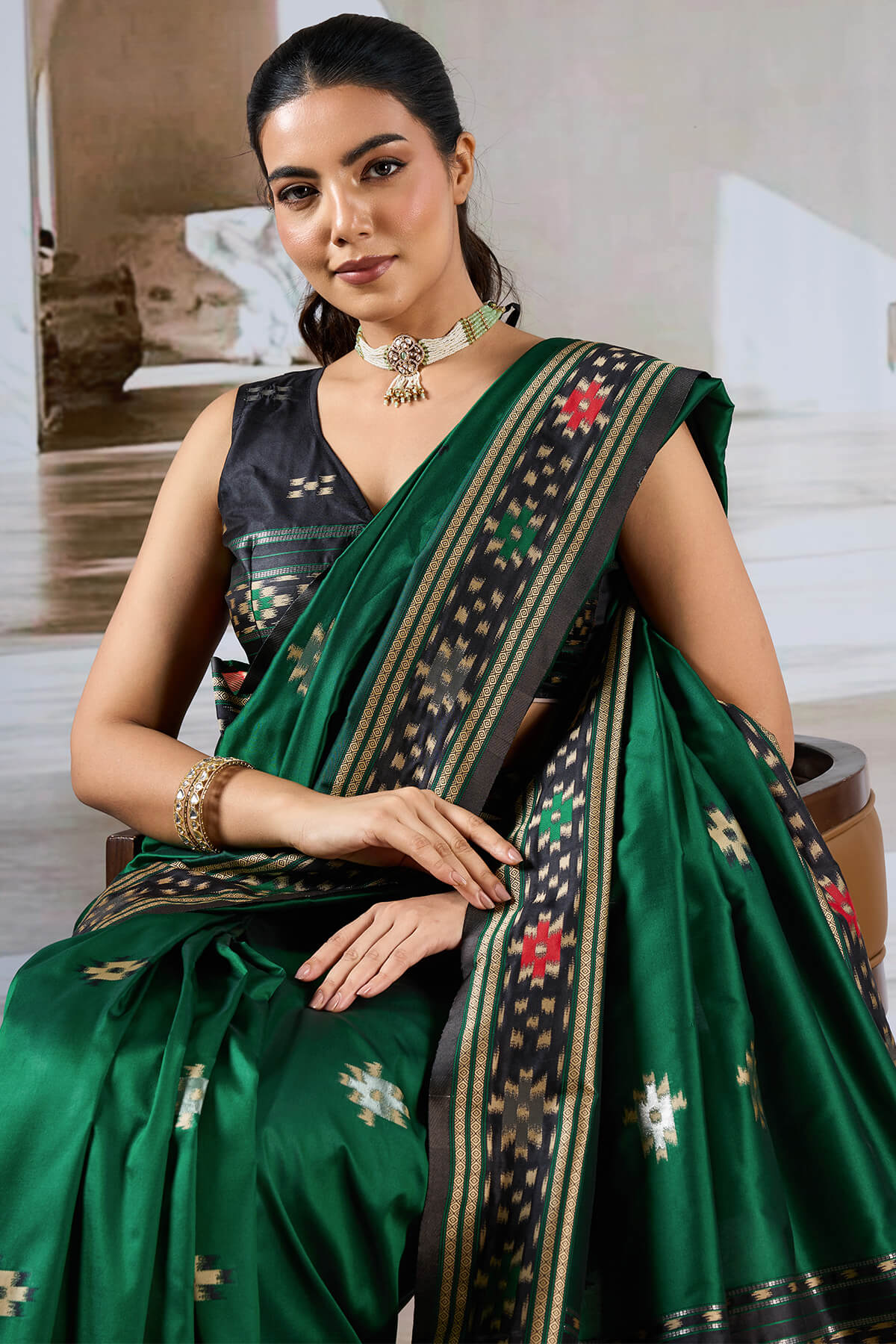 Seraphic Dark Green Patola Silk Saree with Extraordinary Blouse Piece