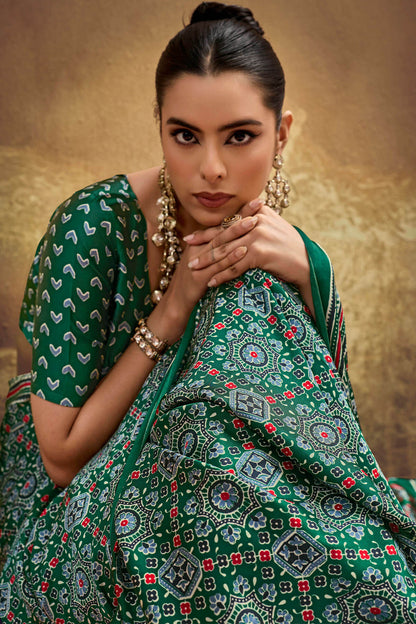 Smashing Dark Green Ajrakh Printed Semi Modal Silk Saree With Opulent Blouse Piece