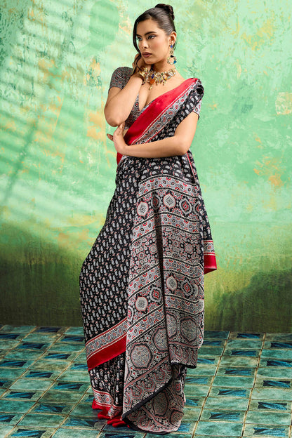 Amazing Black Ajrakh Printed Semi Modal Silk Saree With Beguiling Blouse Piece