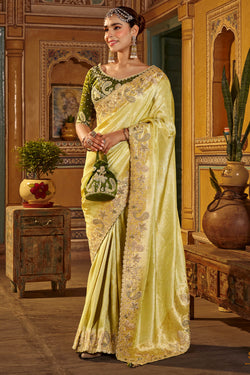 Elaborate Yellow Pure Viscose Hand Embroidery Work Saree With Stitched Blouse