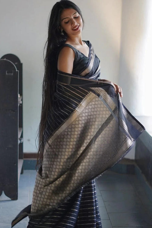 Load image into Gallery viewer, Engrossing Black Soft Banarasi Silk Saree With Flattering Blouse Piece
